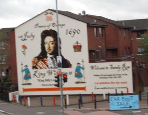 William of Orange, who does a fantastic job of advertising the "car boot sale" in the blue sign on the bottom right. The sale is from the trunks of cars, and is not for the vending of car boots.